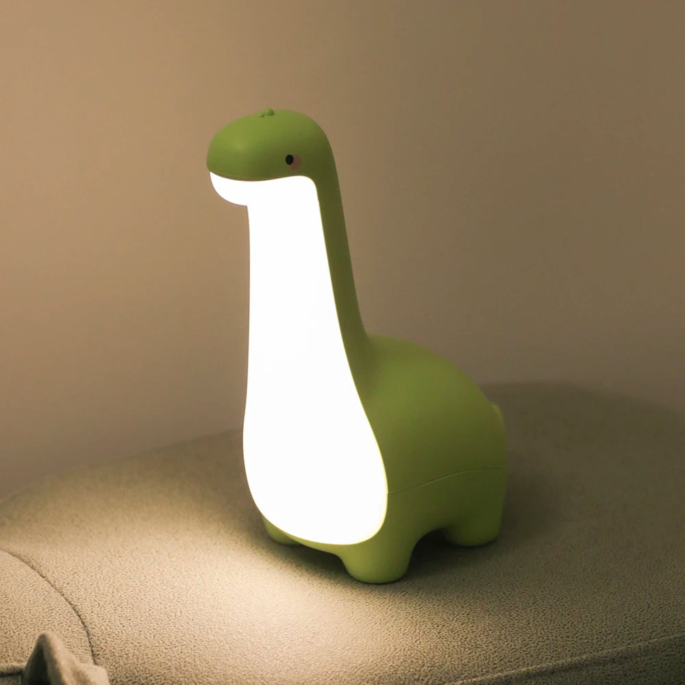 bebe veilleuse lumosaurus mignon