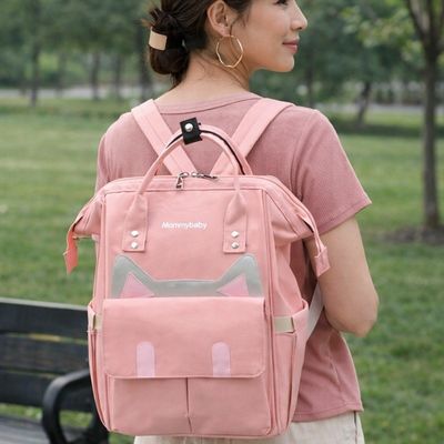 sac a dos a langer catlyn rose porté par maman dans dos