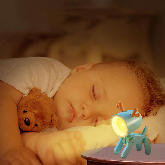 veilleuse bebe lumibot sur table de chevet
